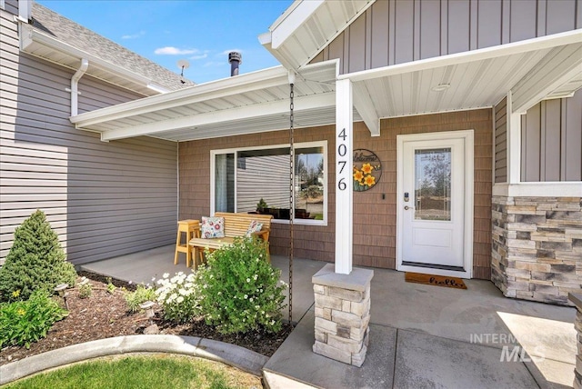 4076 N 3446 E, Kimberly, ID 83341 - property entrance featuring board and batten siding, covered porch, and stone siding