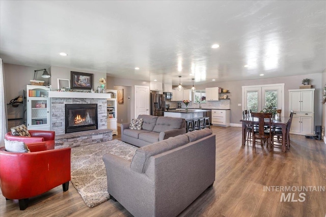 4076 N 3446 E, Kimberly, ID 83341 - living room with wood finished floors, a fireplace, and recessed lighting