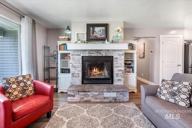 4076 N 3446 E, Kimberly, ID 83341 - living area with a stone fireplace and wood finished floors