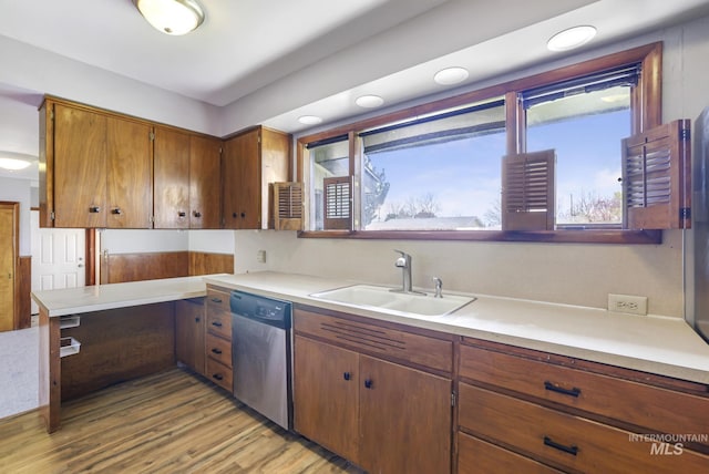 620 Monte Vista Dr, Twin Falls, ID 83301 - kitchen with light wood finished floors, dishwasher, a sink, and light countertops