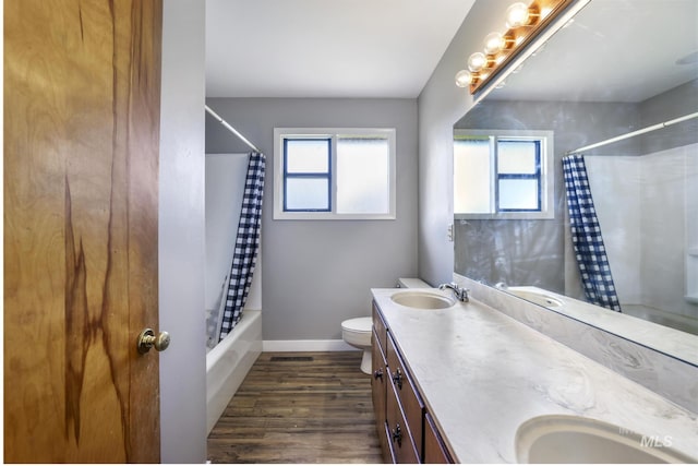 620 Monte Vista Dr, Twin Falls, ID 83301 - full bathroom with a sink, baseboards, wood finished floors, and toilet