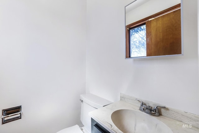 620 Monte Vista Dr, Twin Falls, ID 83301 - half bathroom featuring toilet and vanity