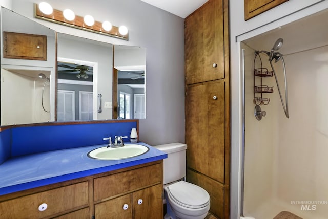 620 Monte Vista Dr, Twin Falls, ID 83301 - full bathroom featuring toilet, ceiling fan, a stall shower, and vanity