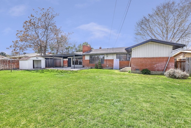 620 Monte Vista Dr, Twin Falls, ID 83301 - back of property featuring a yard, brick siding, and fence