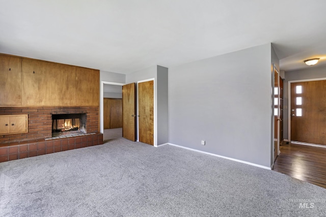 620 Monte Vista Dr, Twin Falls, ID 83301 - unfurnished living room with a fireplace, carpet flooring, and baseboards