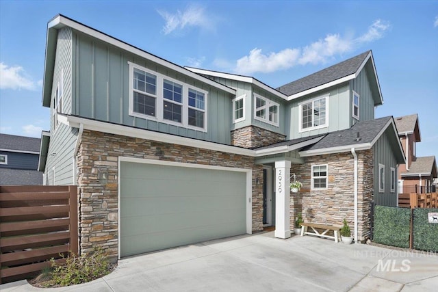 2959 S Shady Ln, Boise, ID 83716 - craftsman inspired home with board and batten siding, stone siding, a garage, and driveway