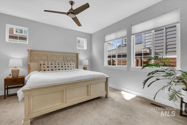 2959 S Shady Ln, Boise, ID 83716 - bedroom with light colored carpet, baseboards, and a ceiling fan
