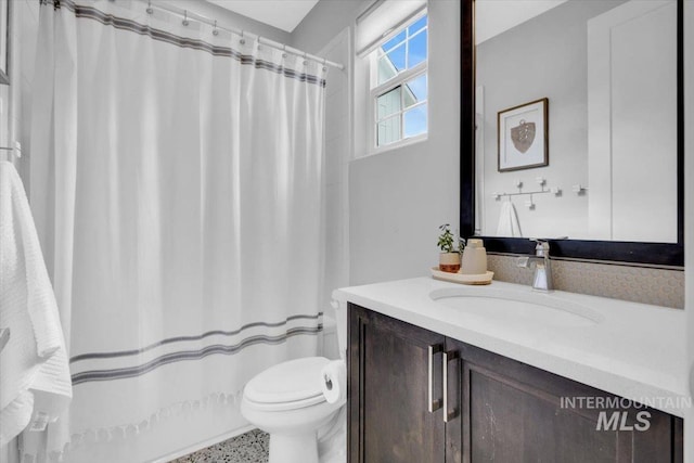 2959 S Shady Ln, Boise, ID 83716 - bathroom with vanity, toilet, and a shower with shower curtain