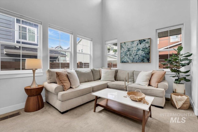 2959 S Shady Ln, Boise, ID 83716 - living room with carpet flooring, baseboards, and a high ceiling