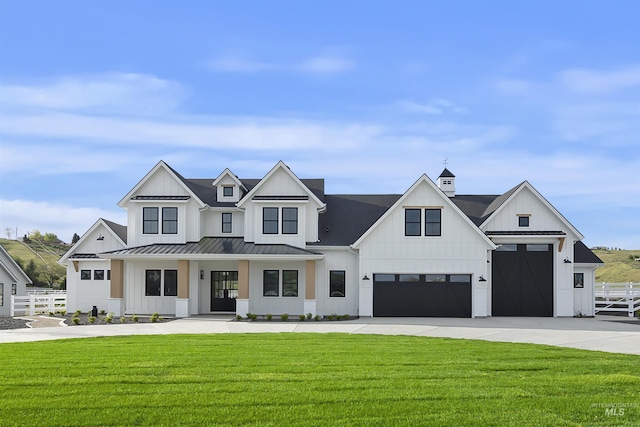 11950 W Lanktree Gulch Rd, Star, ID 83669 - modern farmhouse style home featuring board and batten siding, a garage, driveway, and a standing seam roof