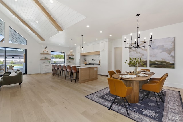 11950 W Lanktree Gulch Rd, Star, ID 83669 - dining area with a chandelier, beamed ceiling, light wood finished floors, and high vaulted ceiling