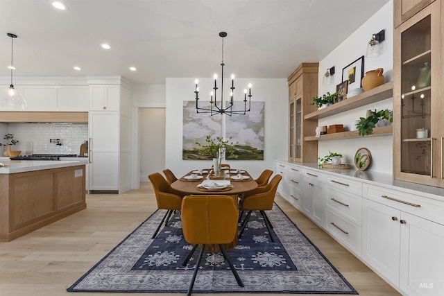 11950 W Lanktree Gulch Rd, Star, ID 83669 - dining area featuring a chandelier, light wood-style floors, and recessed lighting