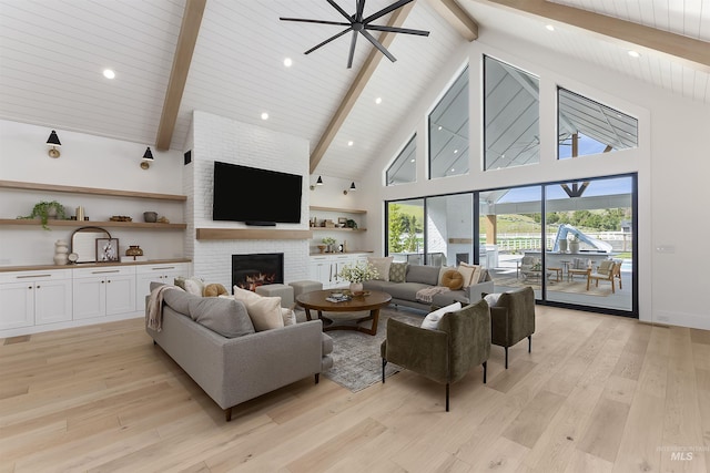 11950 W Lanktree Gulch Rd, Star, ID 83669 - living room featuring beamed ceiling, high vaulted ceiling, a fireplace, light wood-style flooring, and ceiling fan
