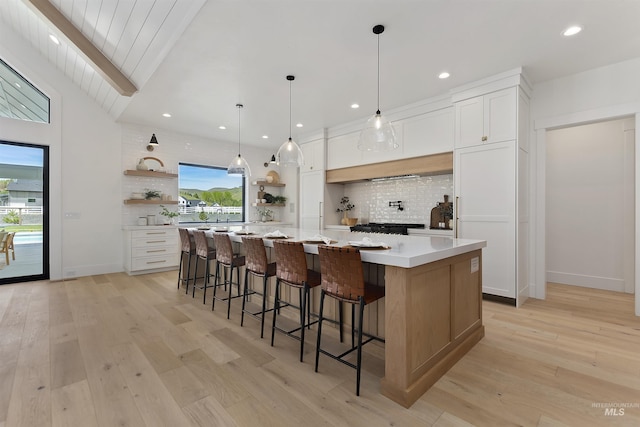 11950 W Lanktree Gulch Rd, Star, ID 83669 - kitchen featuring open shelves, tasteful backsplash, light countertops, white cabinets, and recessed lighting