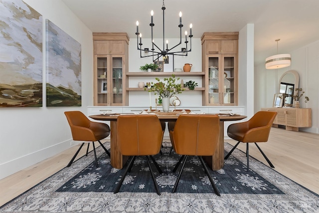 11950 W Lanktree Gulch Rd, Star, ID 83669 - dining room featuring a chandelier and light wood-type flooring