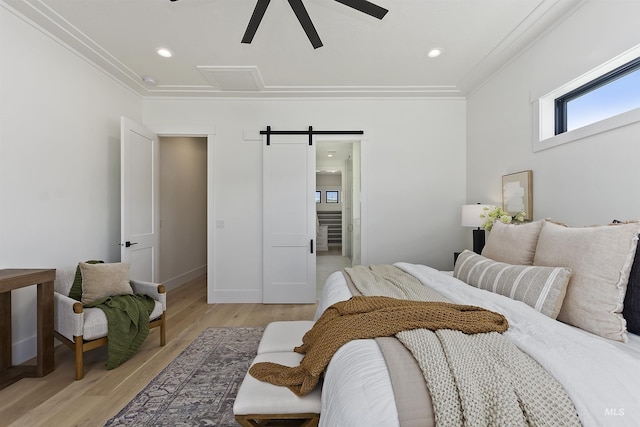 11950 W Lanktree Gulch Rd, Star, ID 83669 - bedroom with a barn door, crown molding, light wood finished floors, a ceiling fan, and recessed lighting