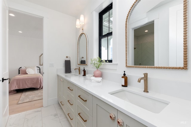 11950 W Lanktree Gulch Rd, Star, ID 83669 - ensuite bathroom featuring double vanity, marble look tiles, and recessed lighting