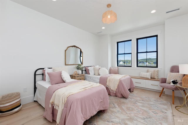 11950 W Lanktree Gulch Rd, Star, ID 83669 - bedroom with light wood finished floors and recessed lighting