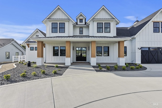 11950 W Lanktree Gulch Rd, Star, ID 83669 - modern farmhouse style home with board and batten siding, a porch, a standing seam roof, and driveway