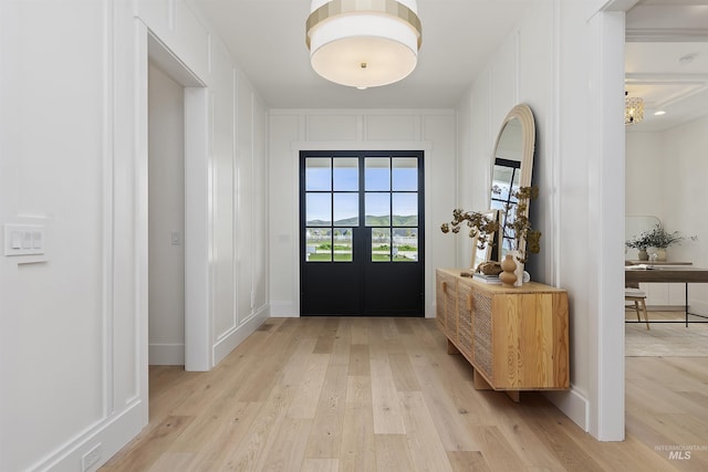 11950 W Lanktree Gulch Rd, Star, ID 83669 - entryway featuring french doors, light wood-style flooring, and a decorative wall
