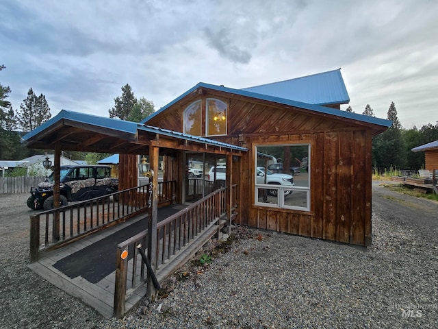 view of property exterior featuring a porch