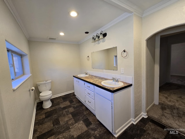 379 S Mill St, Sumpter, OR 97877 - bathroom featuring ornamental molding, stone finish flooring, toilet, baseboards, and double vanity