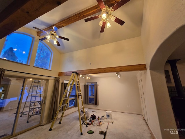 living room with beam ceiling, high vaulted ceiling, and ceiling fan