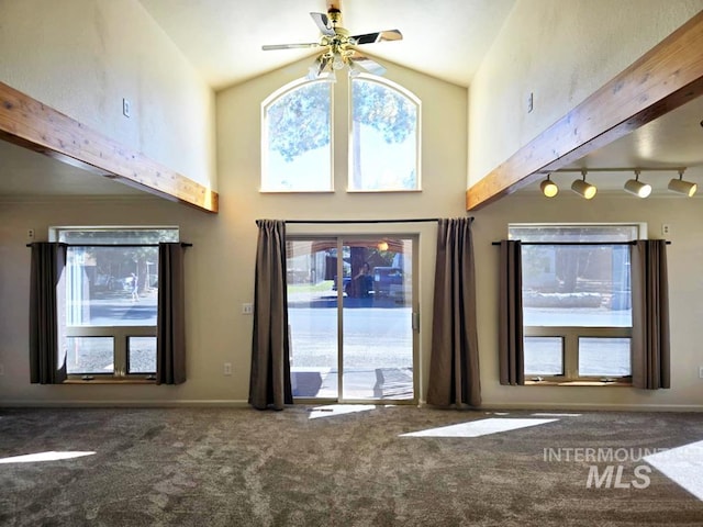 379 S Mill St, Sumpter, OR 97877 - unfurnished living room featuring carpet, a ceiling fan, high vaulted ceiling, and rail lighting
