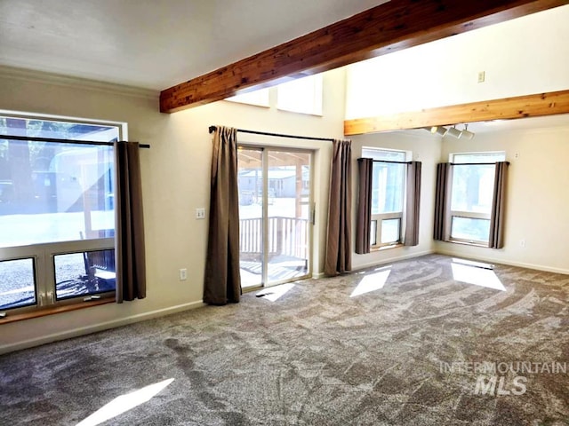 379 S Mill St, Sumpter, OR 97877 - carpeted spare room with beamed ceiling, plenty of natural light, and baseboards