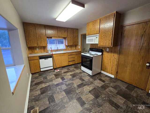 kitchen with white appliances and sink