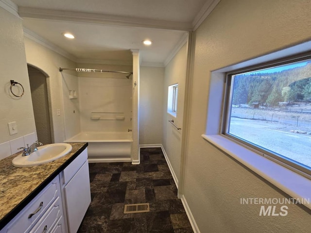 379 S Mill St, Sumpter, OR 97877 - bathroom with ornamental molding, vanity, bathing tub / shower combination, baseboards, and recessed lighting