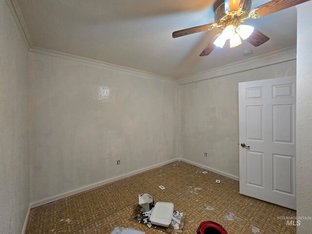 spare room featuring ceiling fan and crown molding