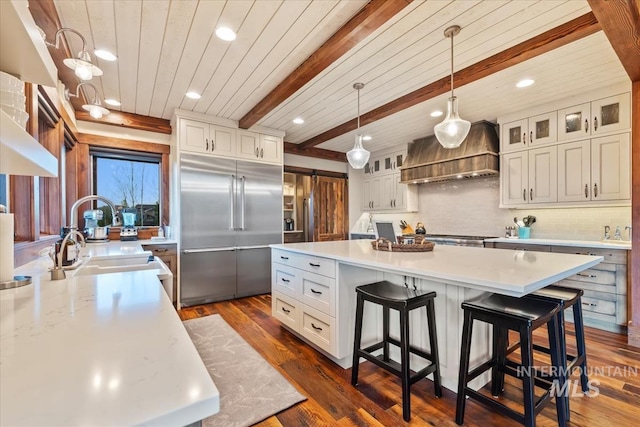 212 Ferguson Way, Mccall, ID 83638 - kitchen with stainless steel built in refrigerator, premium range hood, a kitchen island, light countertops, and recessed lighting