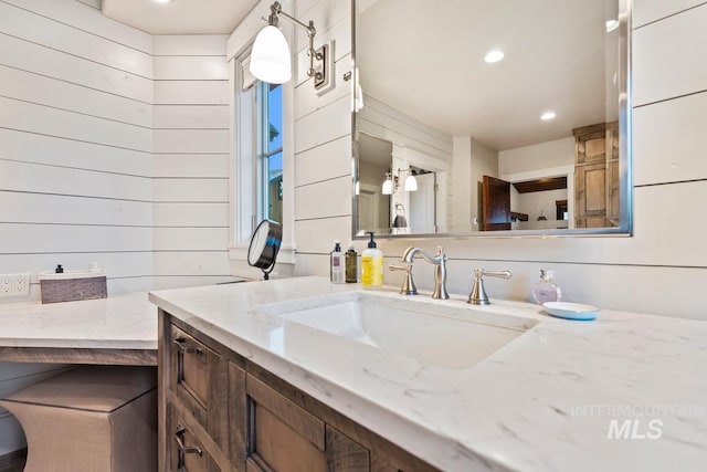 212 Ferguson Way, Mccall, ID 83638 - bathroom featuring wood walls, vanity, and recessed lighting