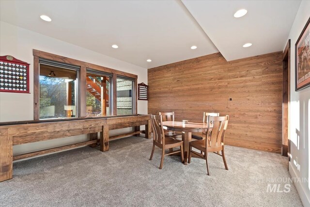 212 Ferguson Way, Mccall, ID 83638 - dining area featuring wooden walls, light colored carpet, and recessed lighting