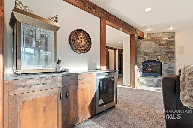 212 Ferguson Way, Mccall, ID 83638 - bar with wine cooler, carpet flooring, a stone fireplace, and recessed lighting