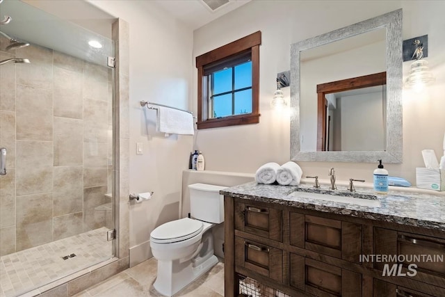 212 Ferguson Way, Mccall, ID 83638 - bathroom featuring a shower stall, toilet, vanity, and tile patterned flooring