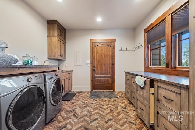 212 Ferguson Way, Mccall, ID 83638 - laundry room featuring washer and dryer, cabinet space, recessed lighting, brick floors, and baseboards