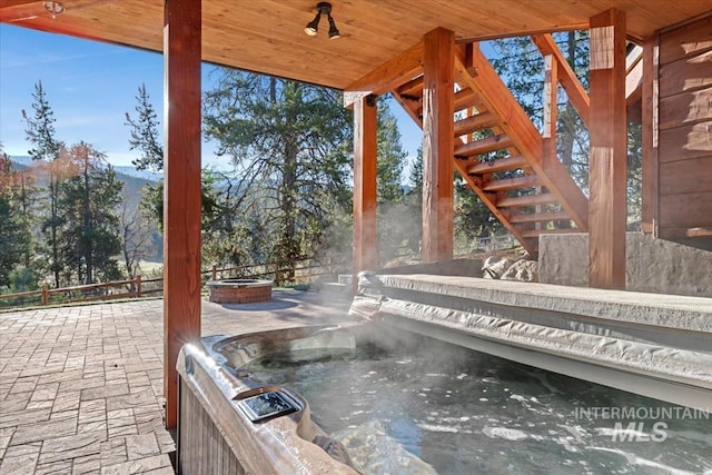 212 Ferguson Way, Mccall, ID 83638 - view of patio / terrace featuring an outdoor fire pit, fence, and stairway