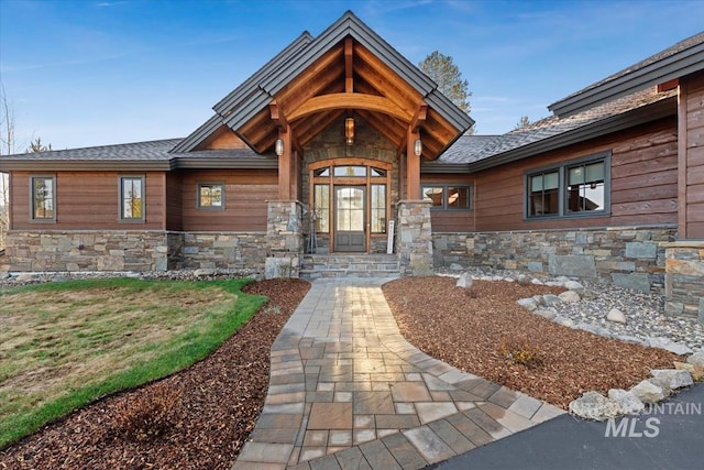 212 Ferguson Way, Mccall, ID 83638 - doorway to property featuring stone siding