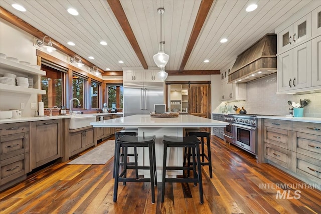212 Ferguson Way, Mccall, ID 83638 - kitchen featuring high end appliances, custom range hood, light countertops, a kitchen island, and recessed lighting