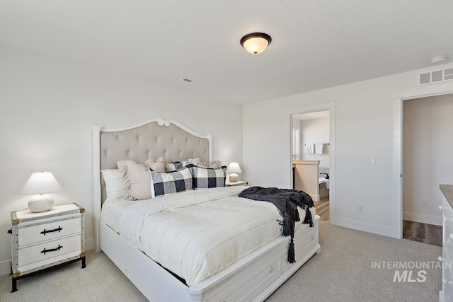 19126 Red Eagle Way, Caldwell, ID 83605 - bedroom with light carpet, baseboards, and ensuite bathroom