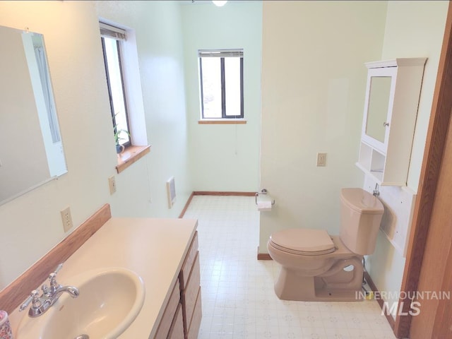 bathroom with vanity and toilet