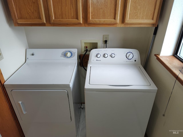 laundry area featuring cabinets and washer and dryer