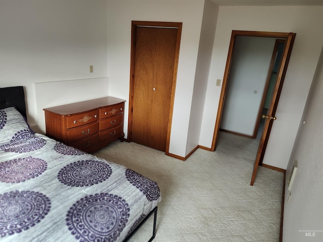 bedroom featuring light colored carpet