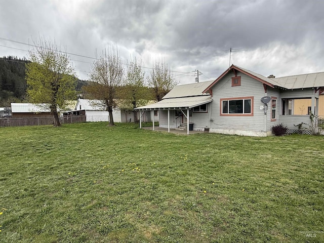 202 S Main St, Kooskia, ID 83539 - rear view of property featuring a yard and a patio