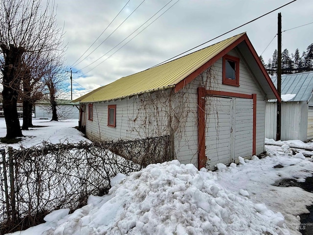 view of snow covered garage