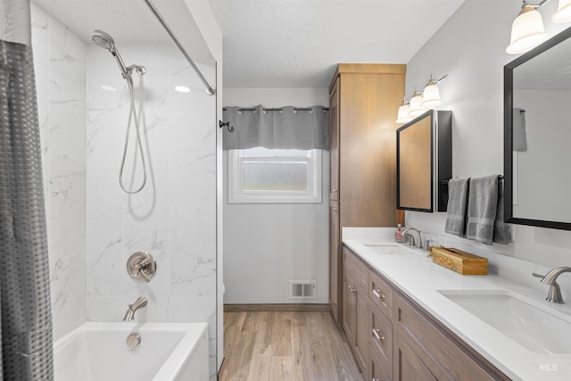 600 18th Ave, Lewiston, ID 83501 - bathroom featuring shower / bathtub combination with curtain, double vanity, and wood finished floors