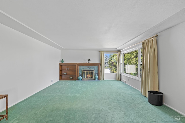 600 18th Ave, Lewiston, ID 83501 - unfurnished living room featuring carpet flooring and a fireplace