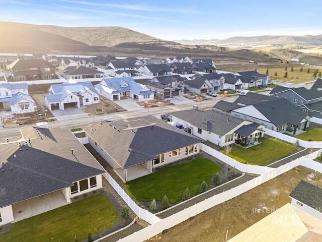 birds eye view of property with a mountain view